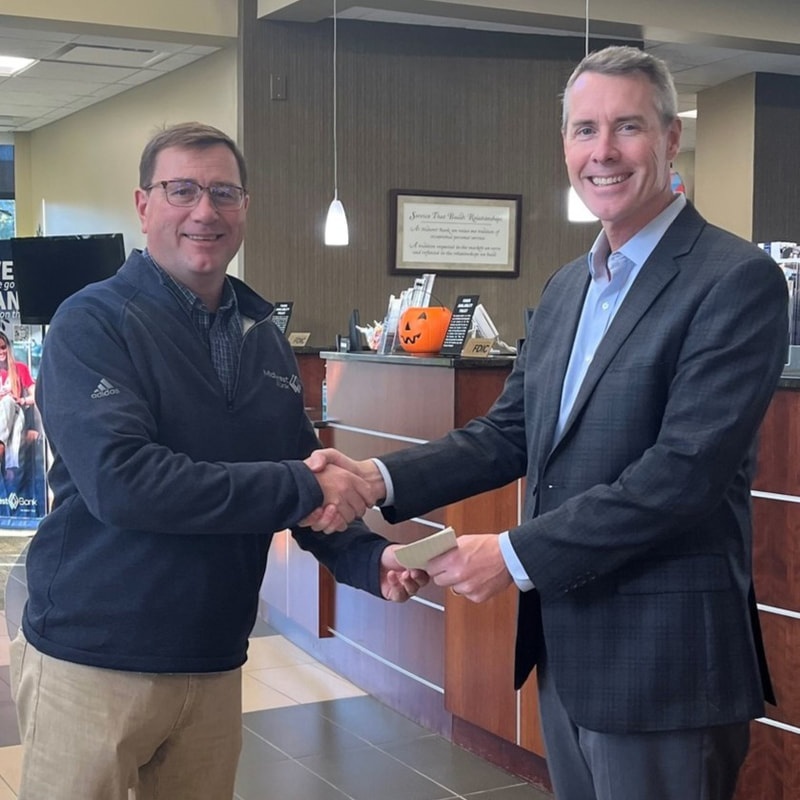 Brian Wolford (right) received recognition for his 10-year anniversary from Brad Koehn, Regional President for Midwest Bank and NBA Chair-Elect.