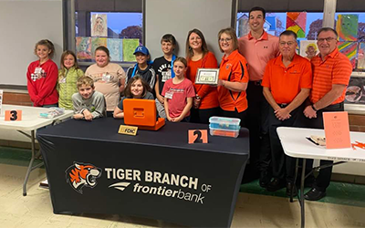 Frontier Bank staff opened an in-school savings bank at an elementary school in Falls City.