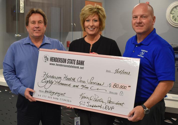 Henderson State Bank President Kevin Postier (left) and Executive Vice President J.B. Suddarth (right) presented a check for the first installment of the bank's pledge to Henderson hospital's capital campaign.
