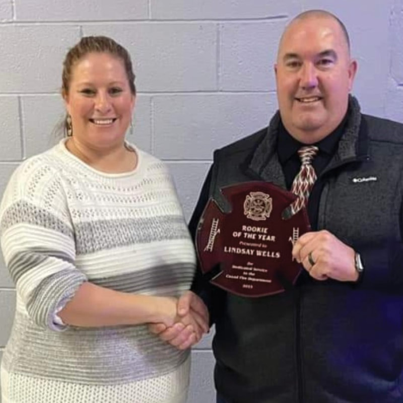 Lindsay Wells (left) received the 2023 Rookie of the Year award from the Cozad Fire and Rescue Department.
