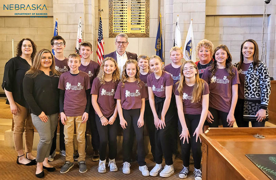 Bankers from CharterWest Bank, teachers from Pender Public Schools and student tellers from the Pendragon branch of CharterWest Bank attended the Financial Awareness Month proclamation signing with Gov. Jim Pillen.
