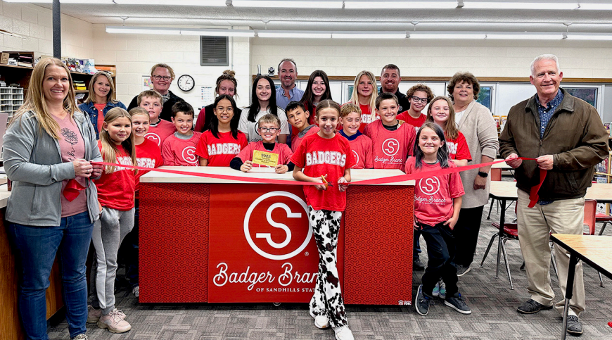 Sandhills State Bank staff and students from Valentine Elementary School celebrated the opening of their in-school savings bank with a ribbon-cutting ceremony.