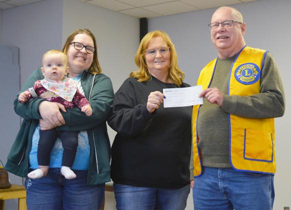 Staff from Western National Bank presented a check to the Cook Lions Club to help fund upkeep projects at the local Community Center.